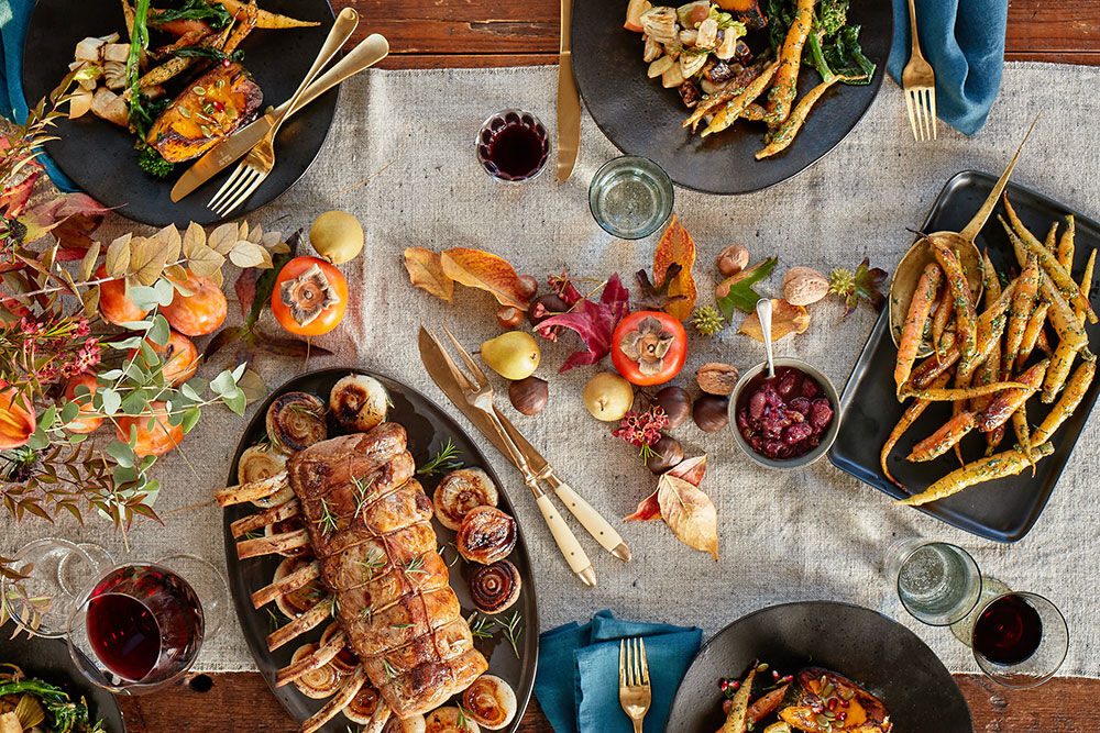 A group cheersing over the dinner table